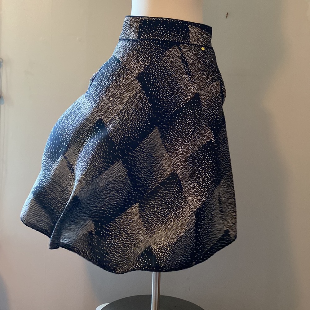 Gently used black and cream patterned circle skirt